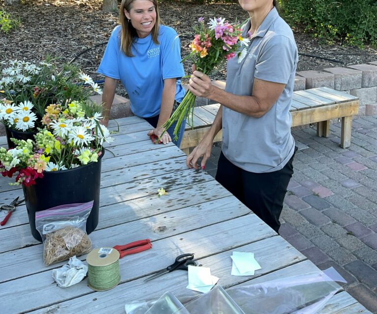 Creating flower bouquets with fresh cut flowers.