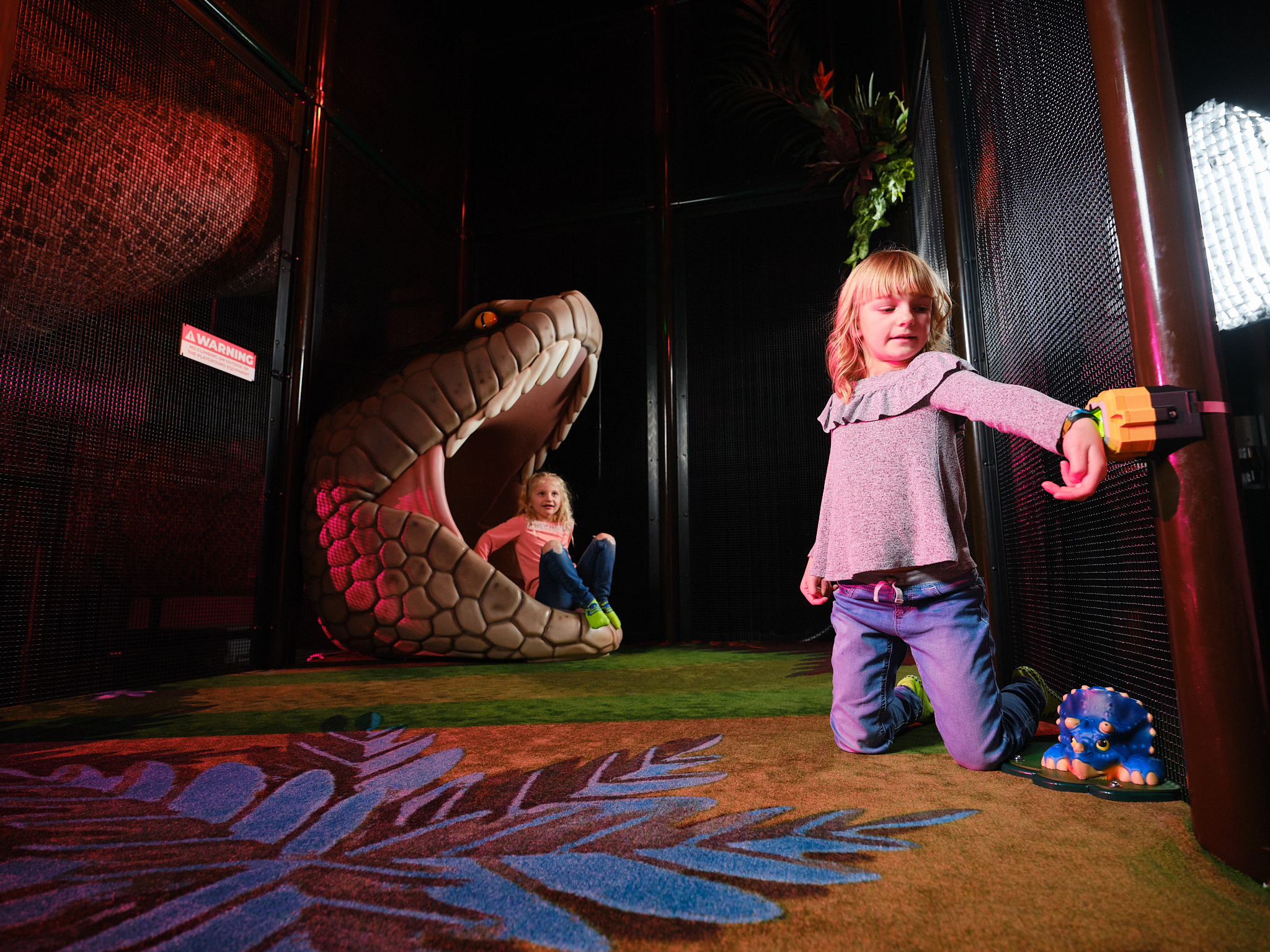 Child playing in Jurassic Jungle