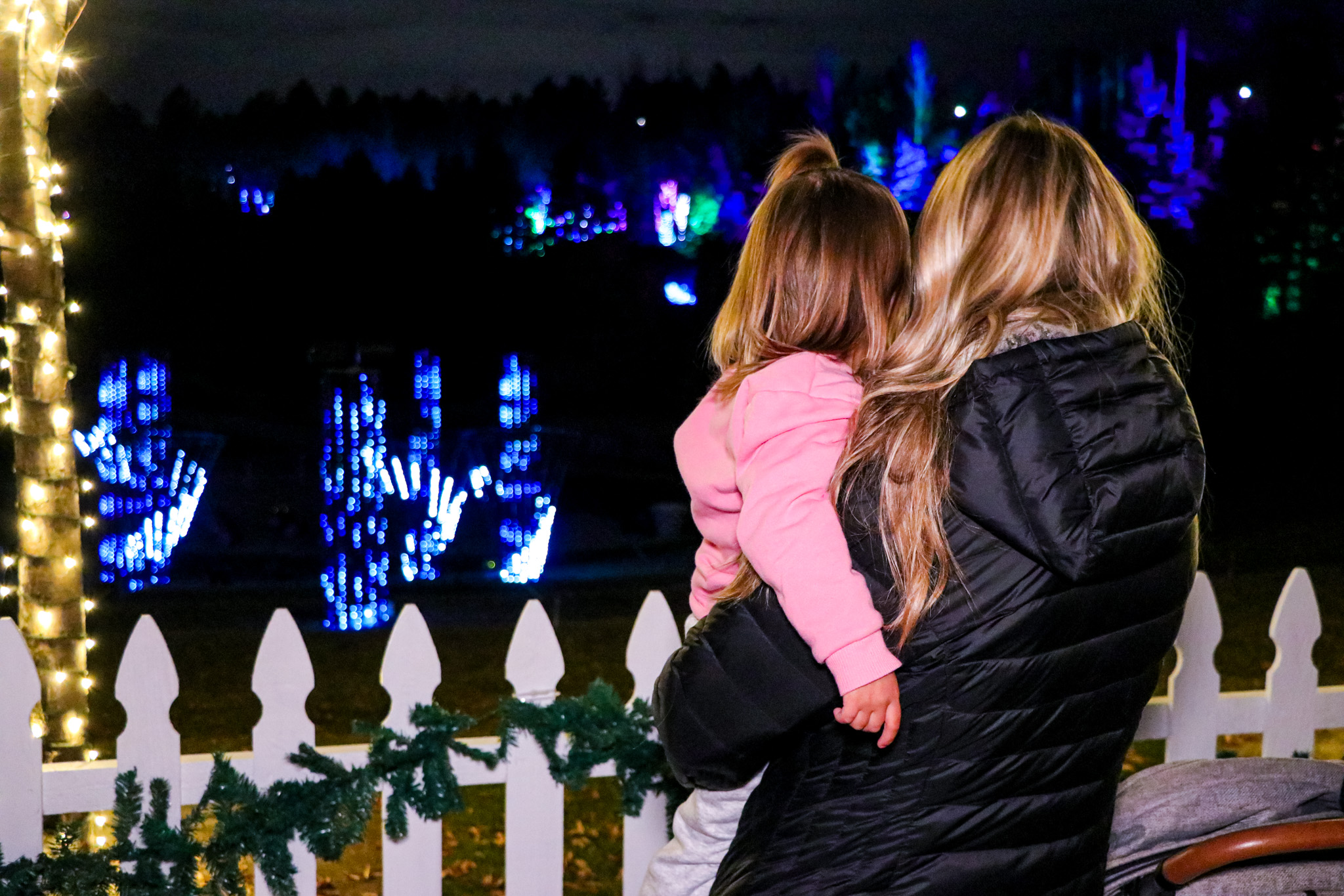 Parent and child watching the glowing displays