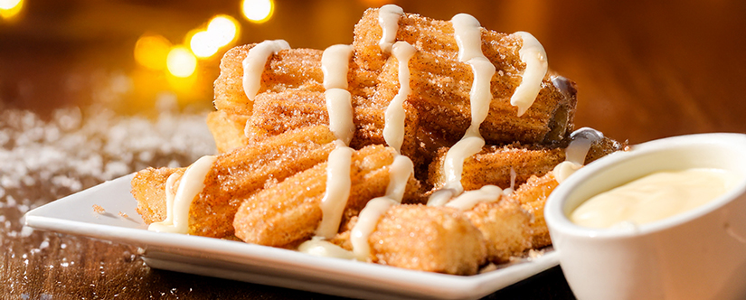 churros with white dippings sauce