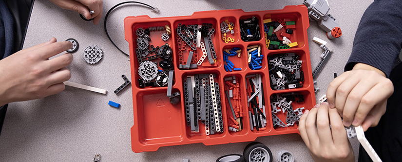 red plastic organizer holding lego pieces