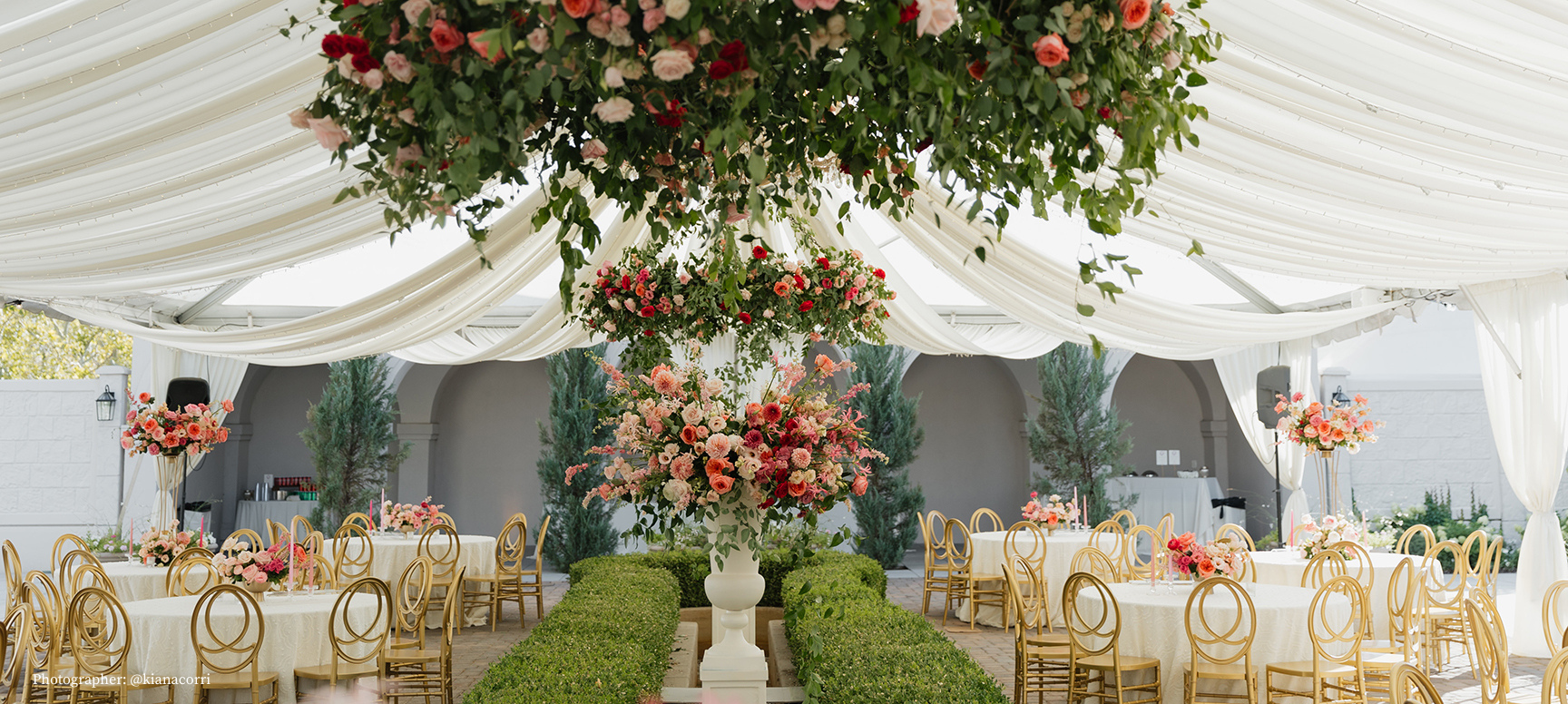 floral chandeliers, golden chairs at tables loggia at thanksgiving point