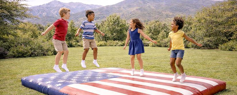 kids jumping on bounce pad