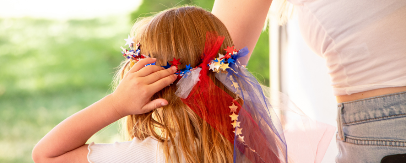 girl putting on sparkle crown
